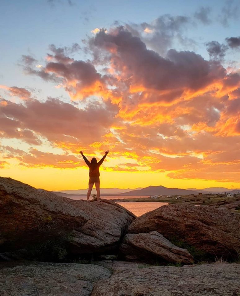 woman standing in the sunset